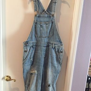 Ripped jean overalls